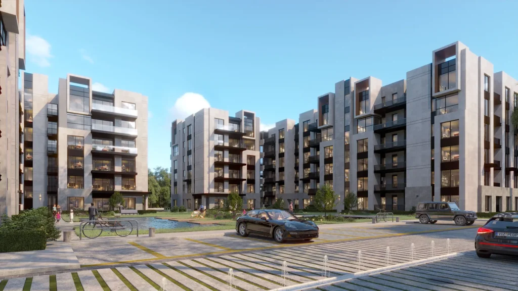 Contemporary apartment complex with landscaped surroundings and parking.