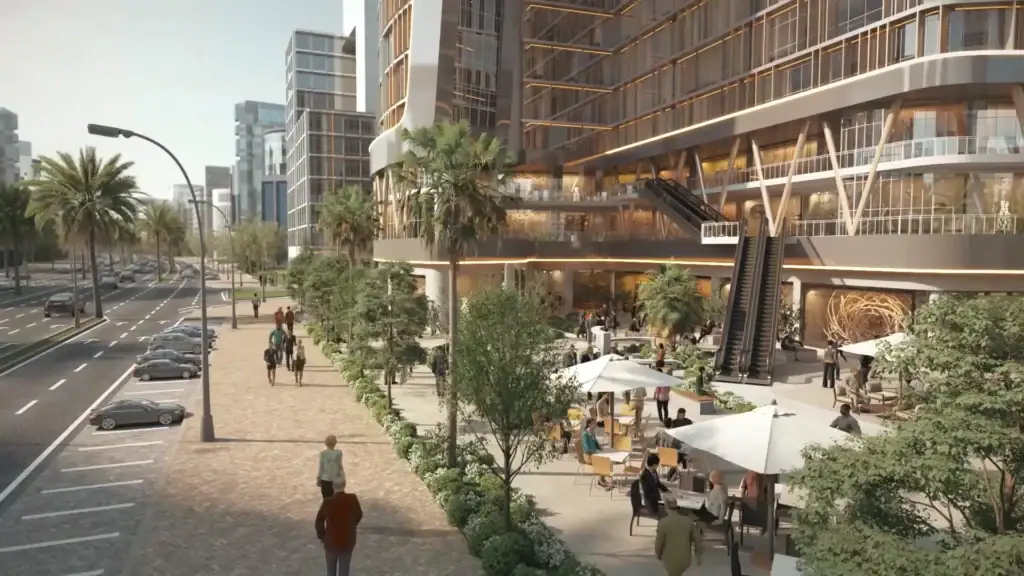 Modern commercial building with outdoor plaza and greenery in downtown.