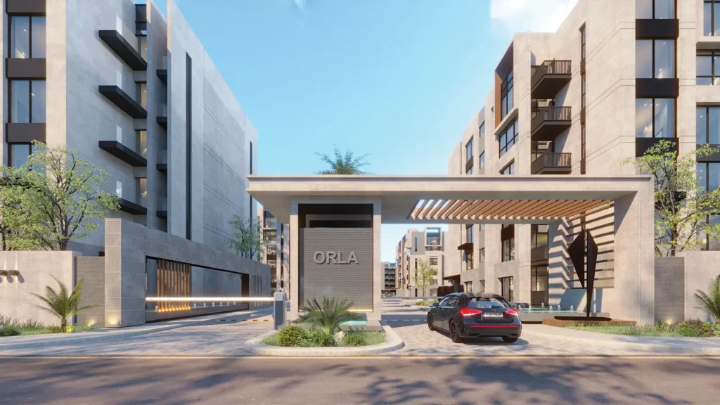 Modern residential complex entrance with contemporary architecture and landscaping.