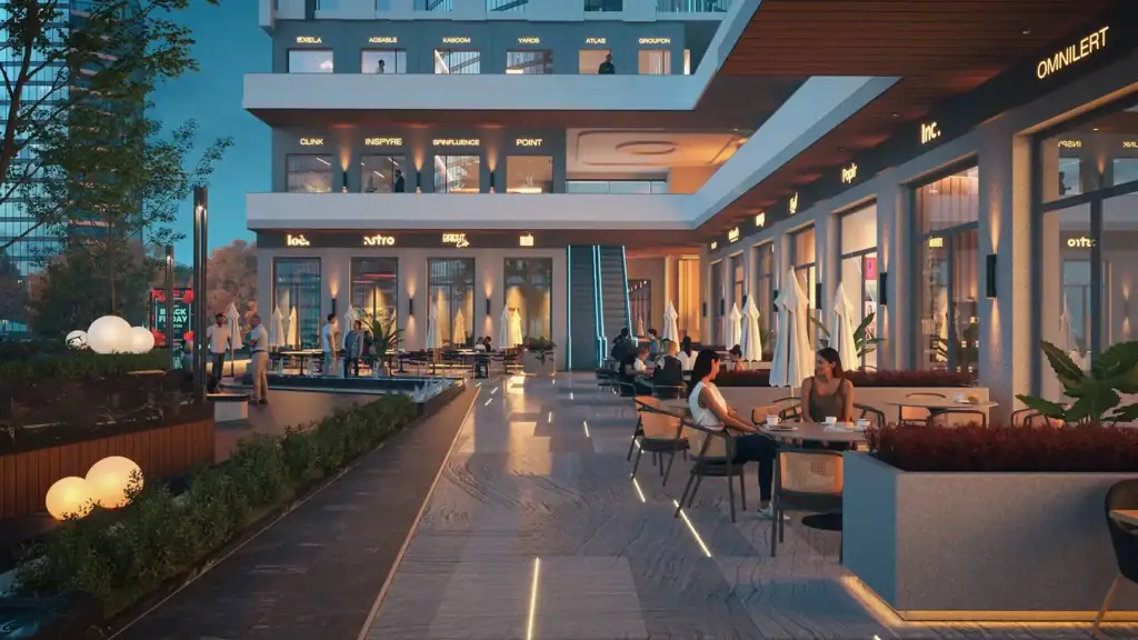 Modern outdoor lounge area at Midly Business Complex with seating and lighting.