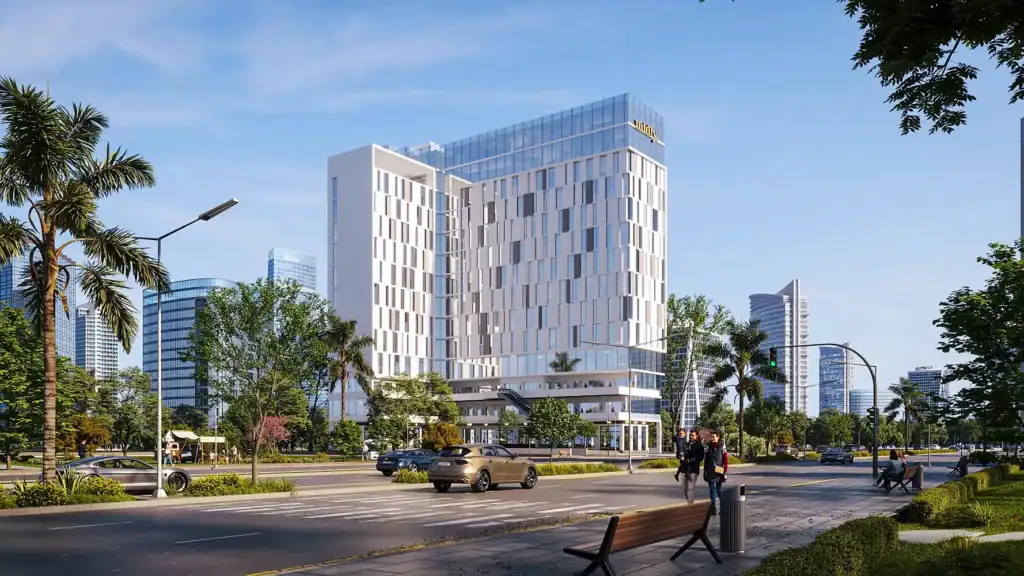 Modern commercial building with glass facade in an urban setting.