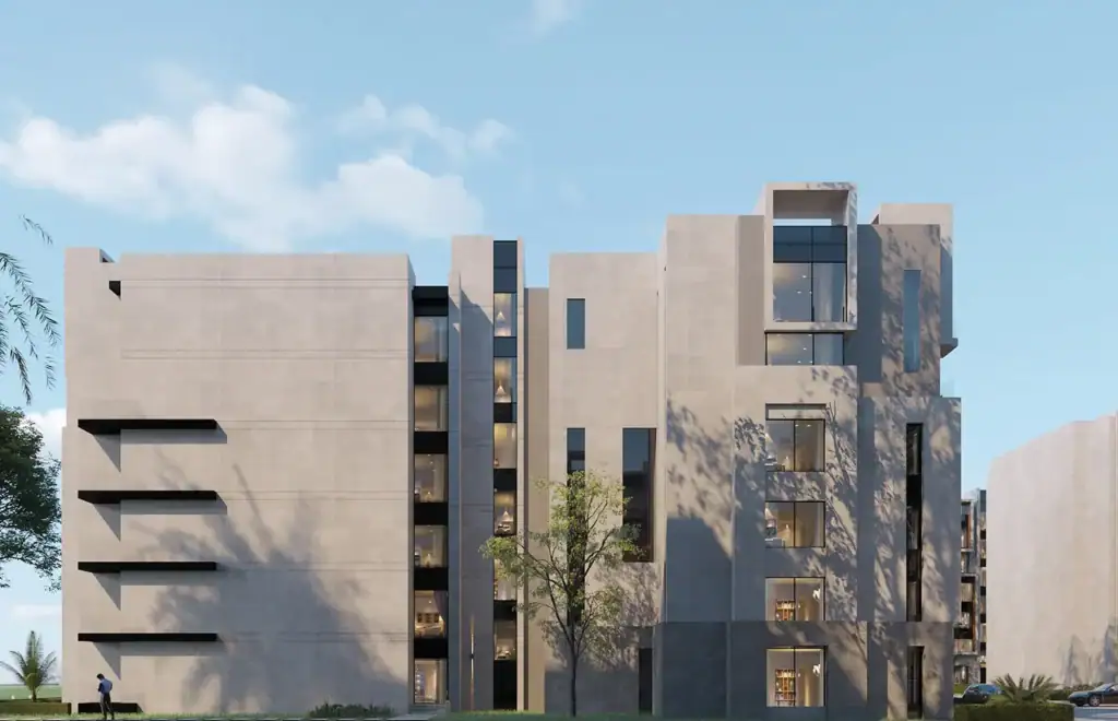 Contemporary apartment complex with minimalist design and large windows.