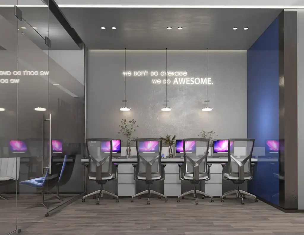 Contemporary office workspace with computers and motivational quote.