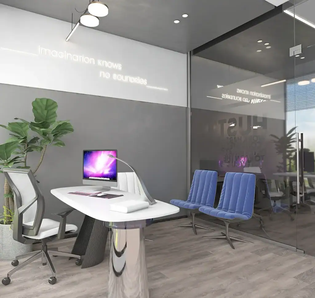 Contemporary office with desk, chairs, and glass walls at i8 Business Complex.
