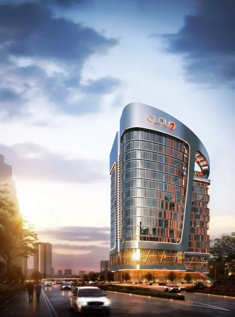 Modern iCapital building with sleek glass facade and curved design at sunset.