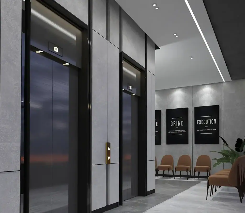 Contemporary elevator lobby with sleek design and seating area at i8 Business Complex.