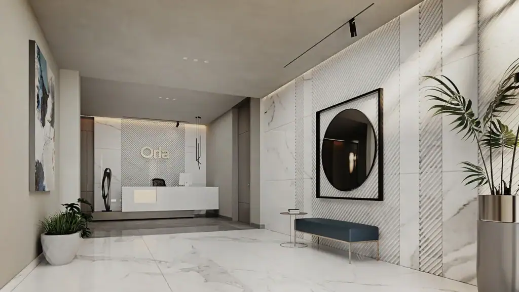 Modern lobby with marble walls and minimalist decor at Orla Residence.